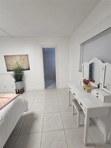 a living room with furniture and white walls