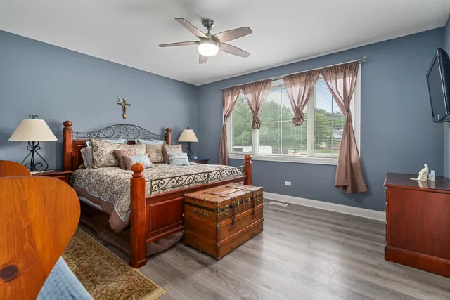 a bed room with a bed and a chandelier