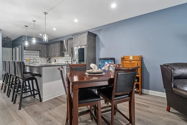 a dining room with furniture and window