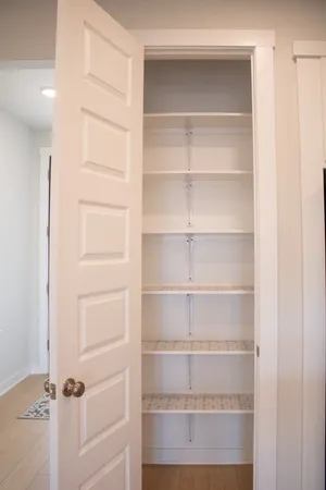 a view of a room with shelves