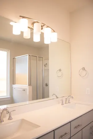a view of a hallway to closet and utility room