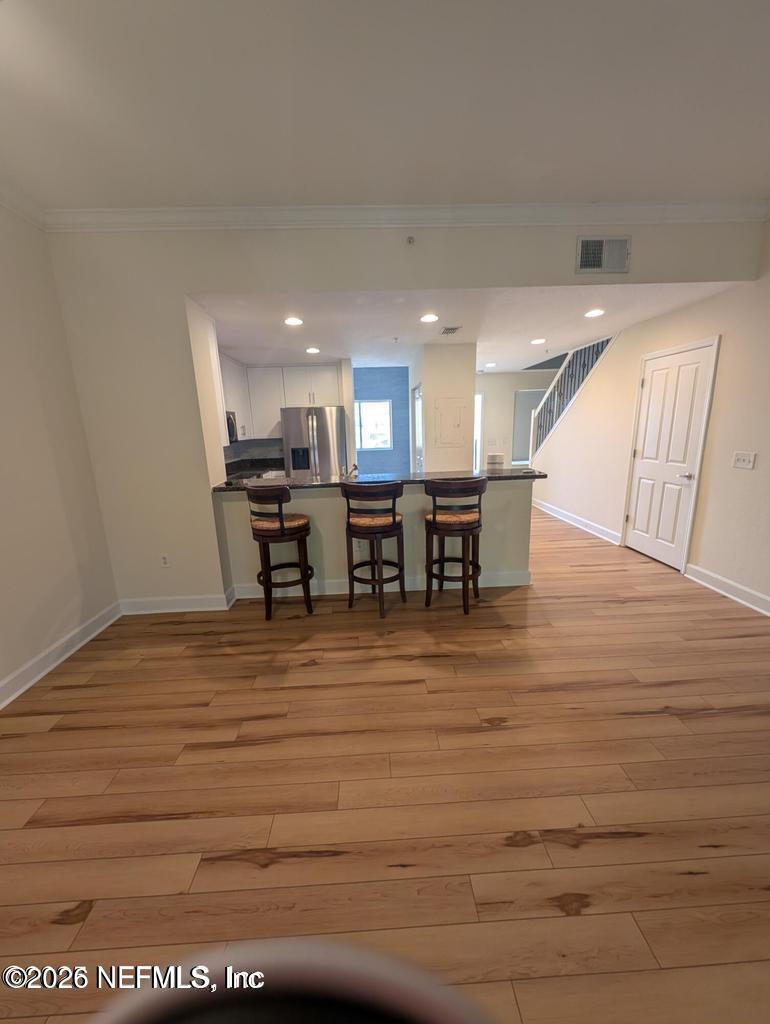 9745 Touchton Road, Unit 2327 Jacksonville, FL 32246 - Photo 4 of 19 FAMILY ROOM TO KITCHEN