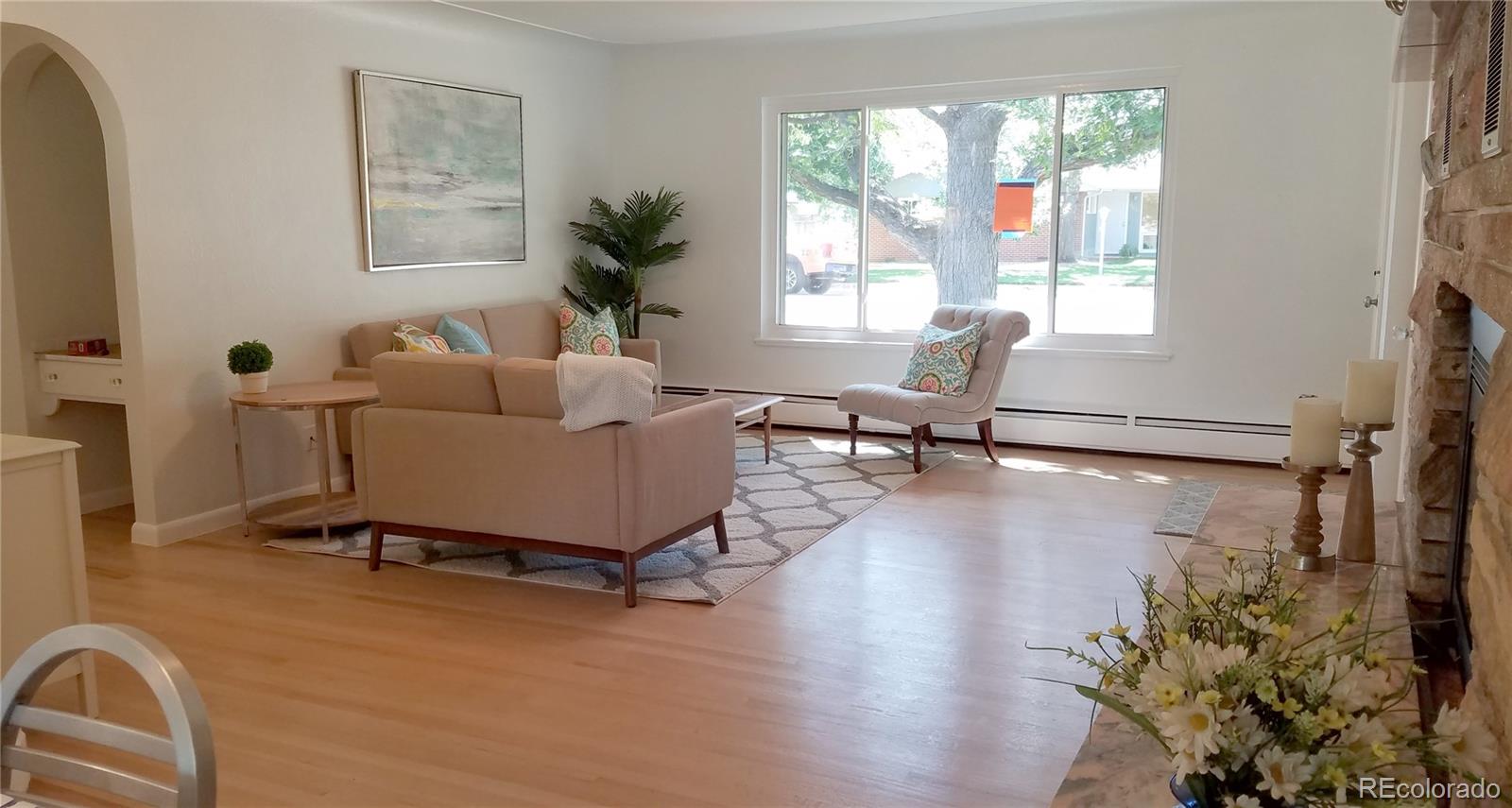 4630 Quay Street Wheat Ridge, CO 80033 - Photo 2 of 36 a living room with furniture and a window