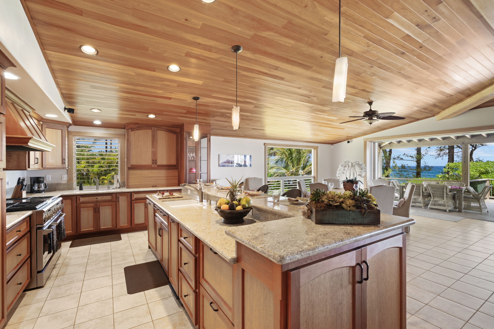 7312 Alealea Road Hanalei, HI 96714 - Photo 8 of 30 a kitchen with stainless steel appliances granite countertop a sink and cabinets