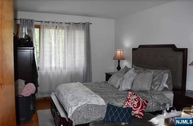 a bedroom with a bed and closet