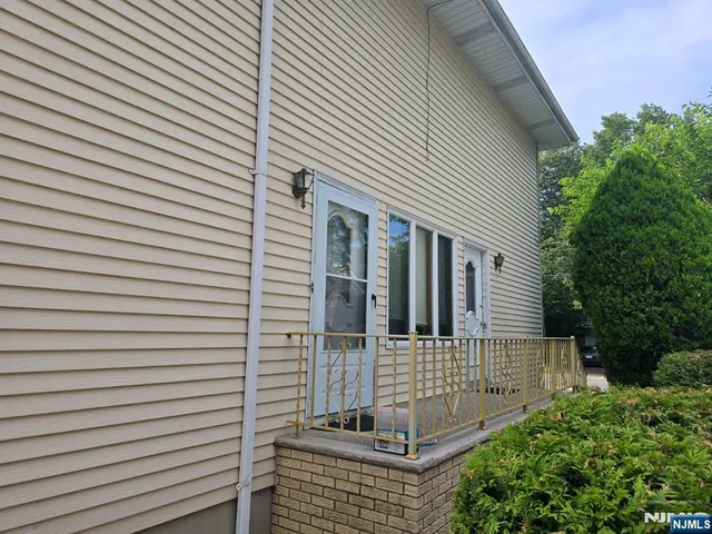 a view of a house with large windows