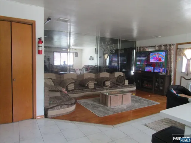a living room with fireplace furniture and a flat screen tv