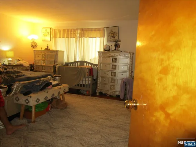 a view of a patio with table and chairs