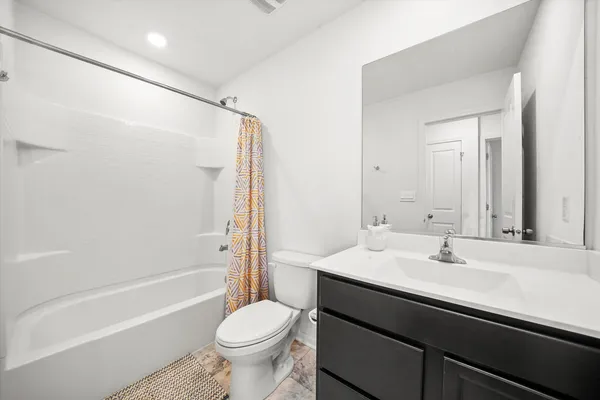 a bathroom with a sink a toilet and a bathtub