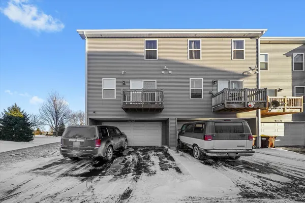 a front view of a house with parking space