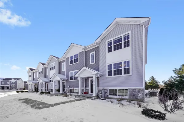 a front view of a building with street view