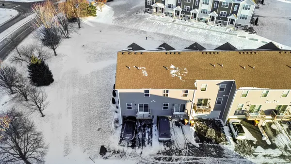 a view of a patio with table and chairs