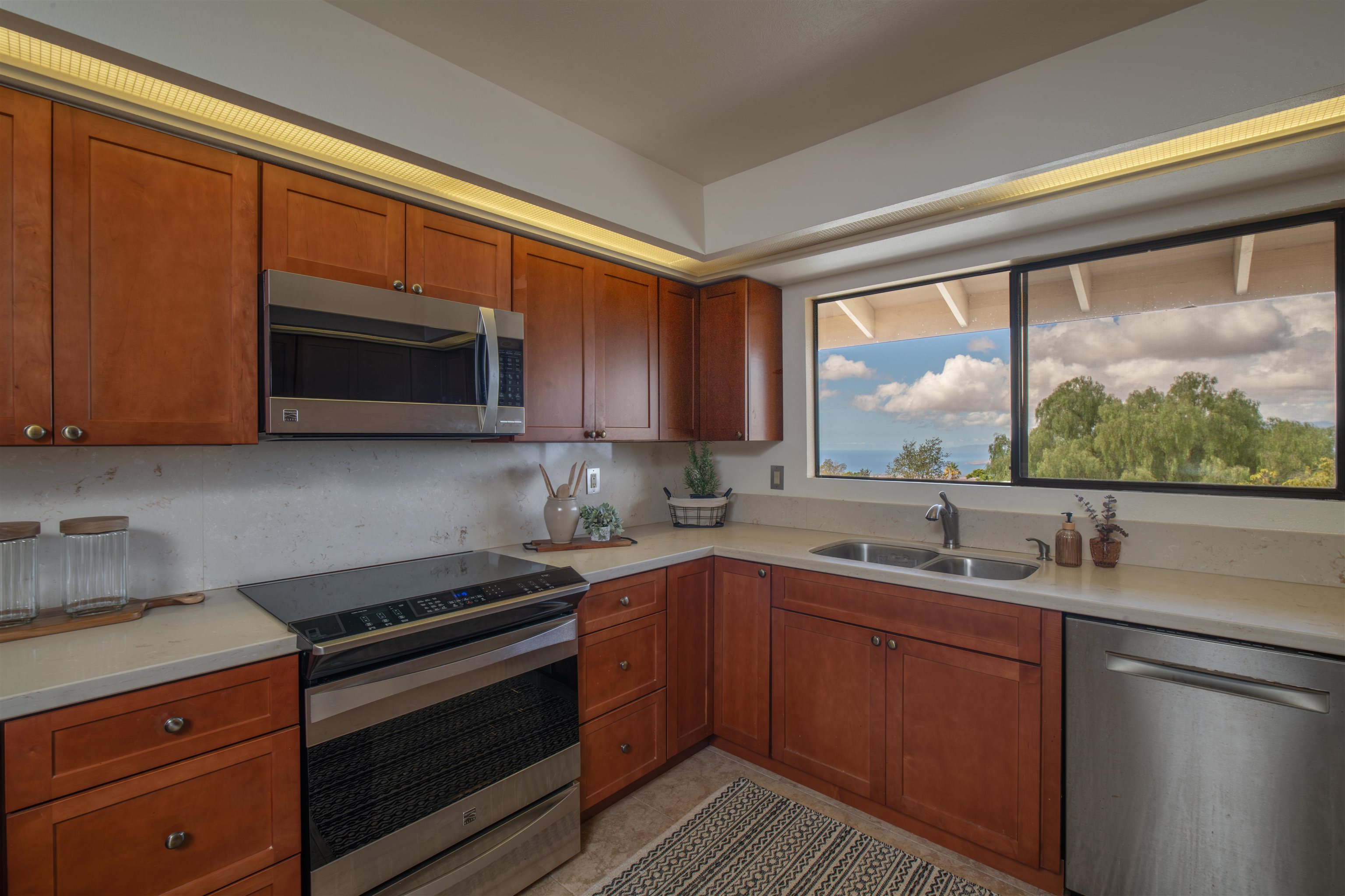 358 Holopuni Road Kula, HI 96790 - Photo 11 of 49 a kitchen with a sink stove and microwave