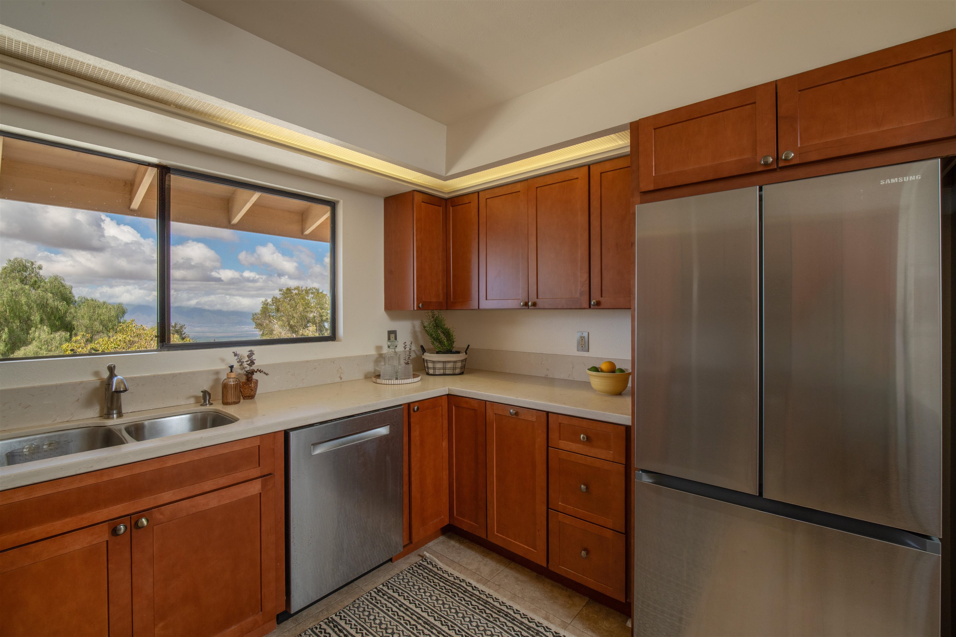 358 Holopuni Road Kula, HI 96790 - Photo 12 of 49 a kitchen with stainless steel appliances granite countertop a refrigerator and a sink
