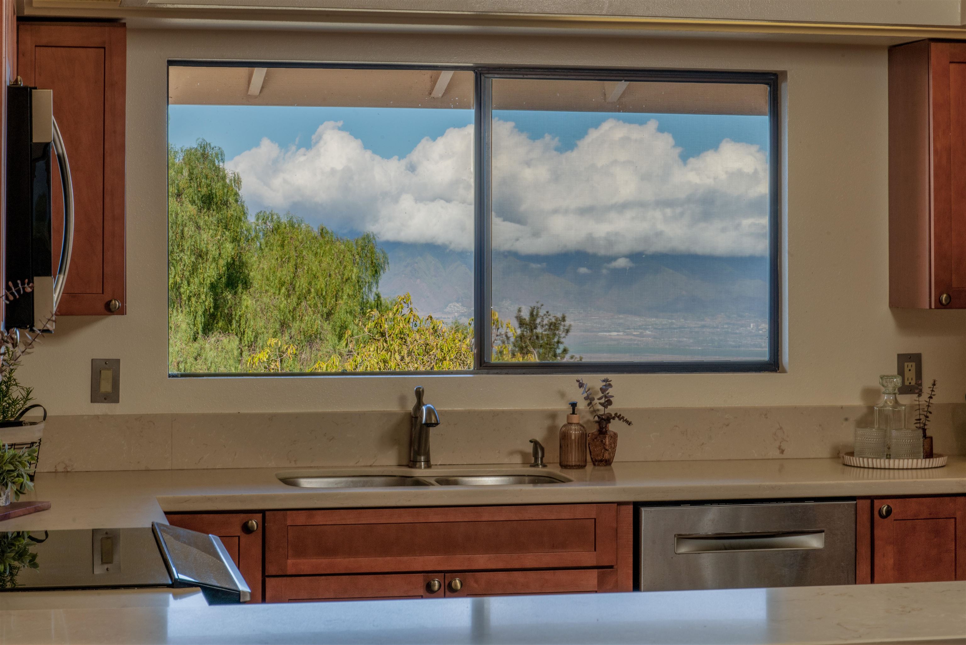 358 Holopuni Road Kula, HI 96790 - Photo 13 of 49 a view of a sink a mirror and a window