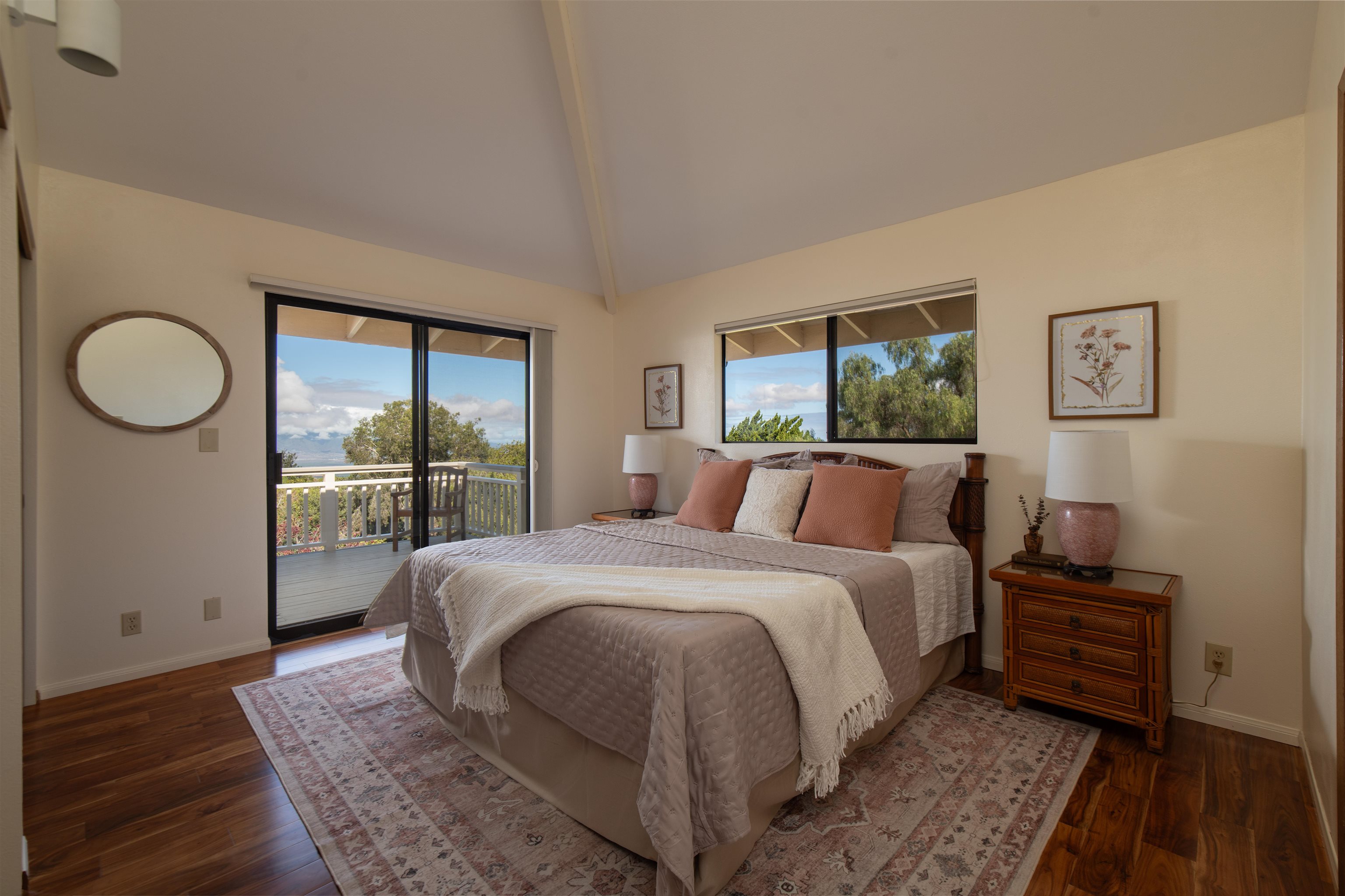 358 Holopuni Road Kula, HI 96790 - Photo 14 of 49 a large bedroom with a bed and wooden floor