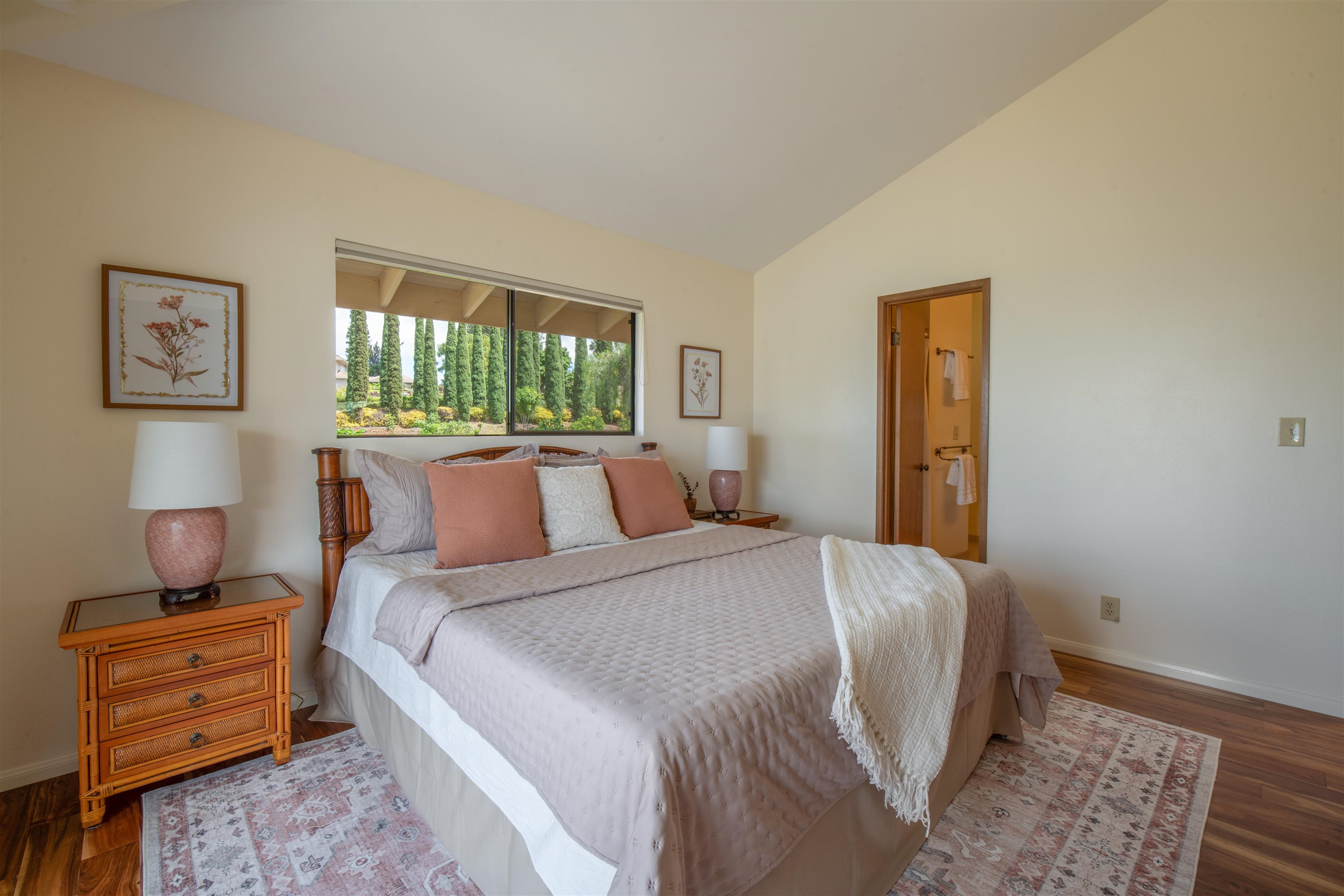 358 Holopuni Road Kula, HI 96790 - Photo 15 of 49 a bedroom with a bed and wooden floor