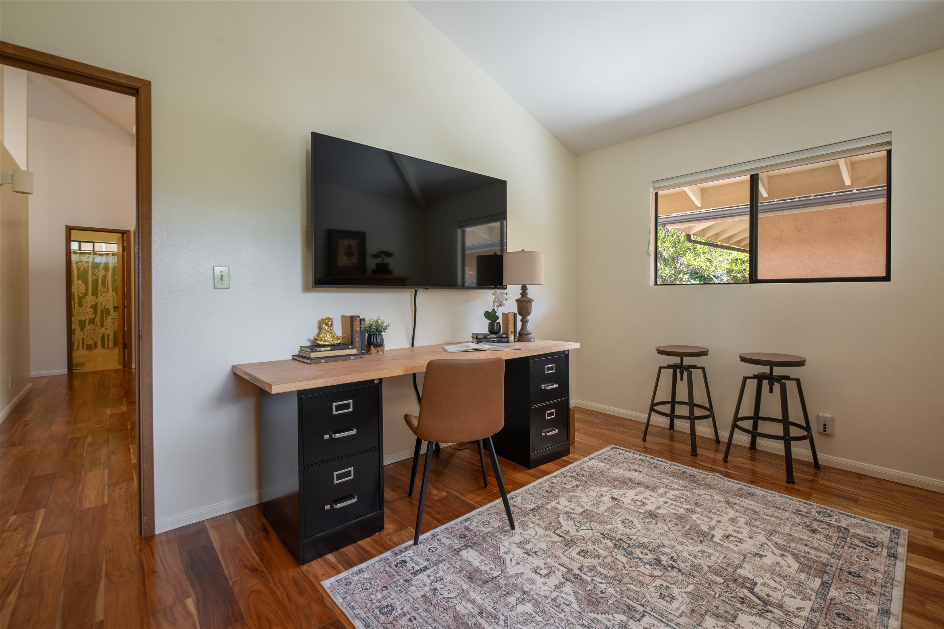 358 Holopuni Road Kula, HI 96790 - Photo 22 of 49 a view of a workspace with furniture and wooden floor