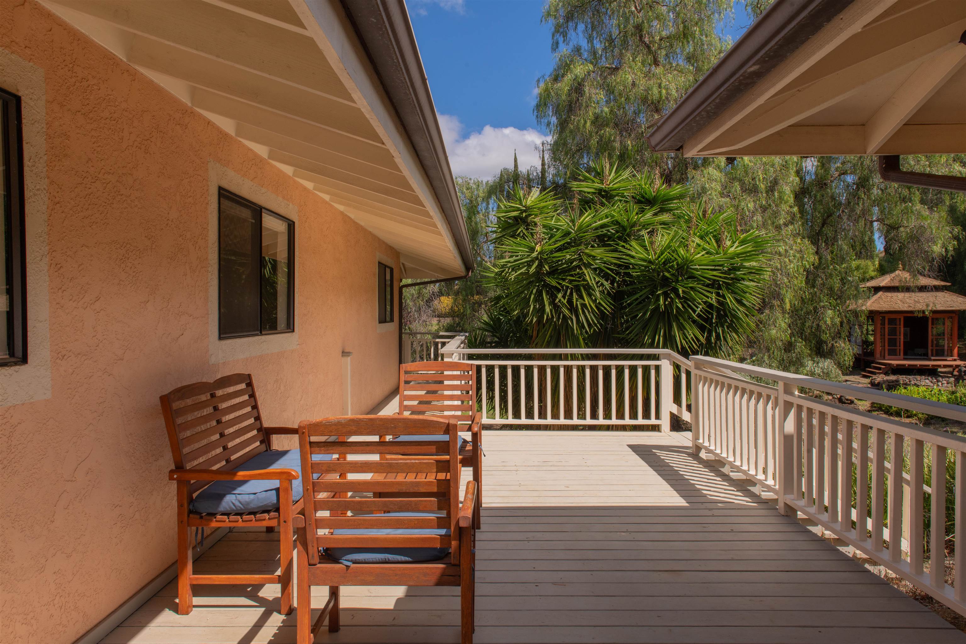 358 Holopuni Road Kula, HI 96790 - Photo 25 of 49 a view of balcony with wooden floor and outdoor seating