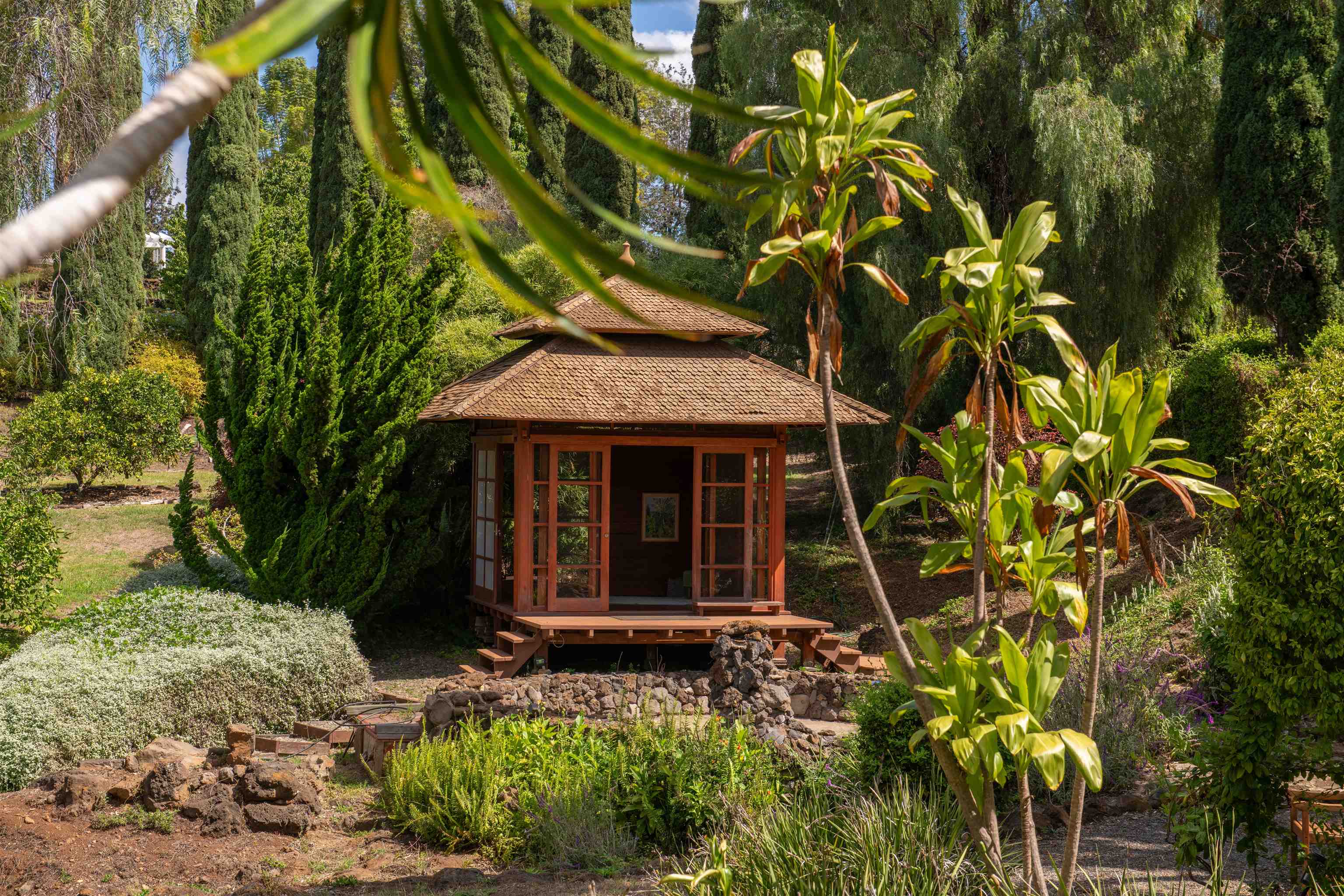 358 Holopuni Road Kula, HI 96790 - Photo 30 of 49 a front view of a house with a yard