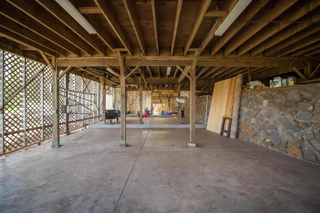 a view of a house with backyard and garden