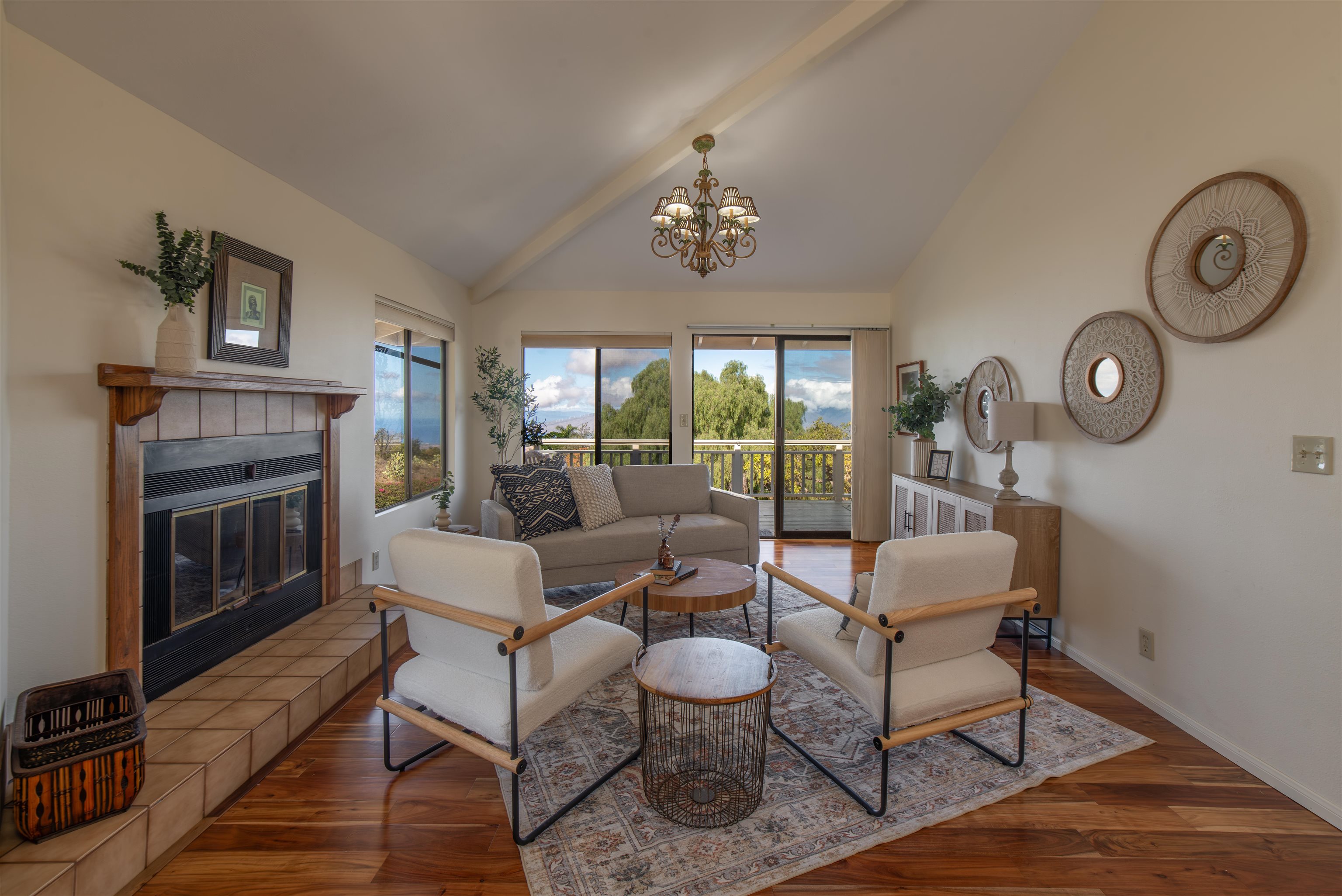 358 Holopuni Road Kula, HI 96790 - Photo 8 of 49 a living room with furniture a fireplace and a table
