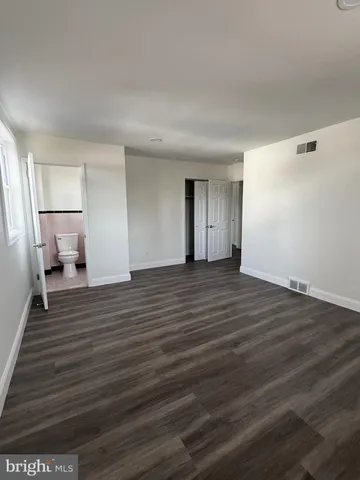 a view of a livingroom with wooden floor