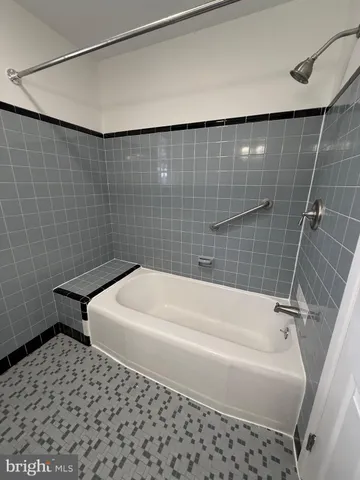 a bathroom with a white bathtub