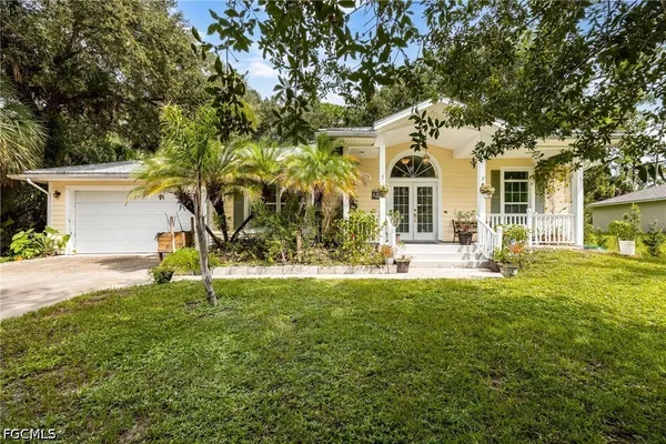 a front view of a house with a yard