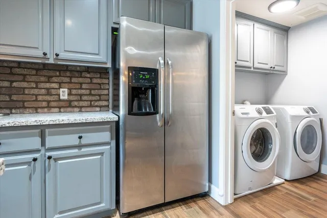 a kitchen with a refrigerator and a sink