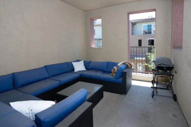 a living room with furniture and a window