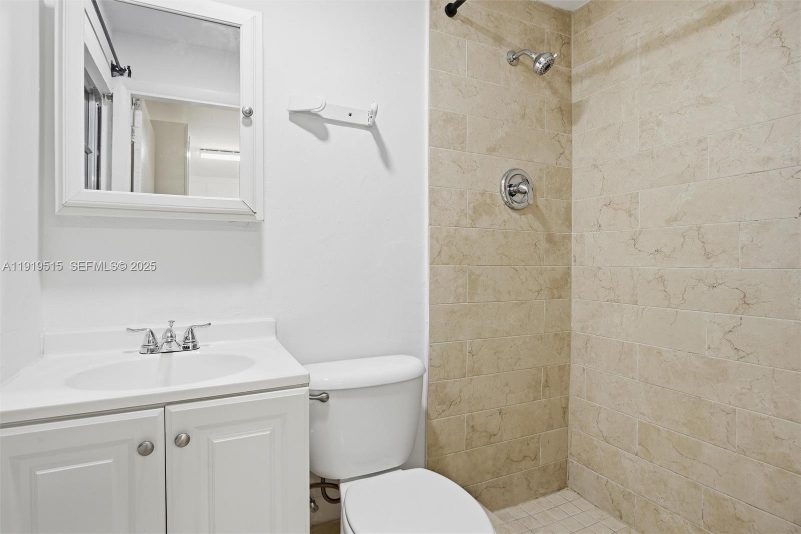 2445 Southwest 18th Street, Unit 5 Miami, FL 33145 - Photo 8 of 10 a bathroom with a sink toilet and shower