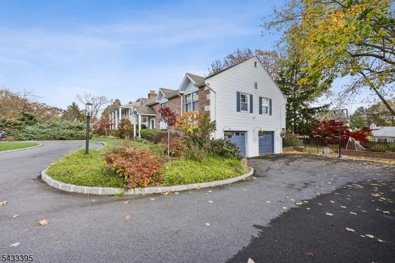 48 Woodmont Road Montclair, NJ 07043 - Photo 19 of 20 a house with a yard and a trees