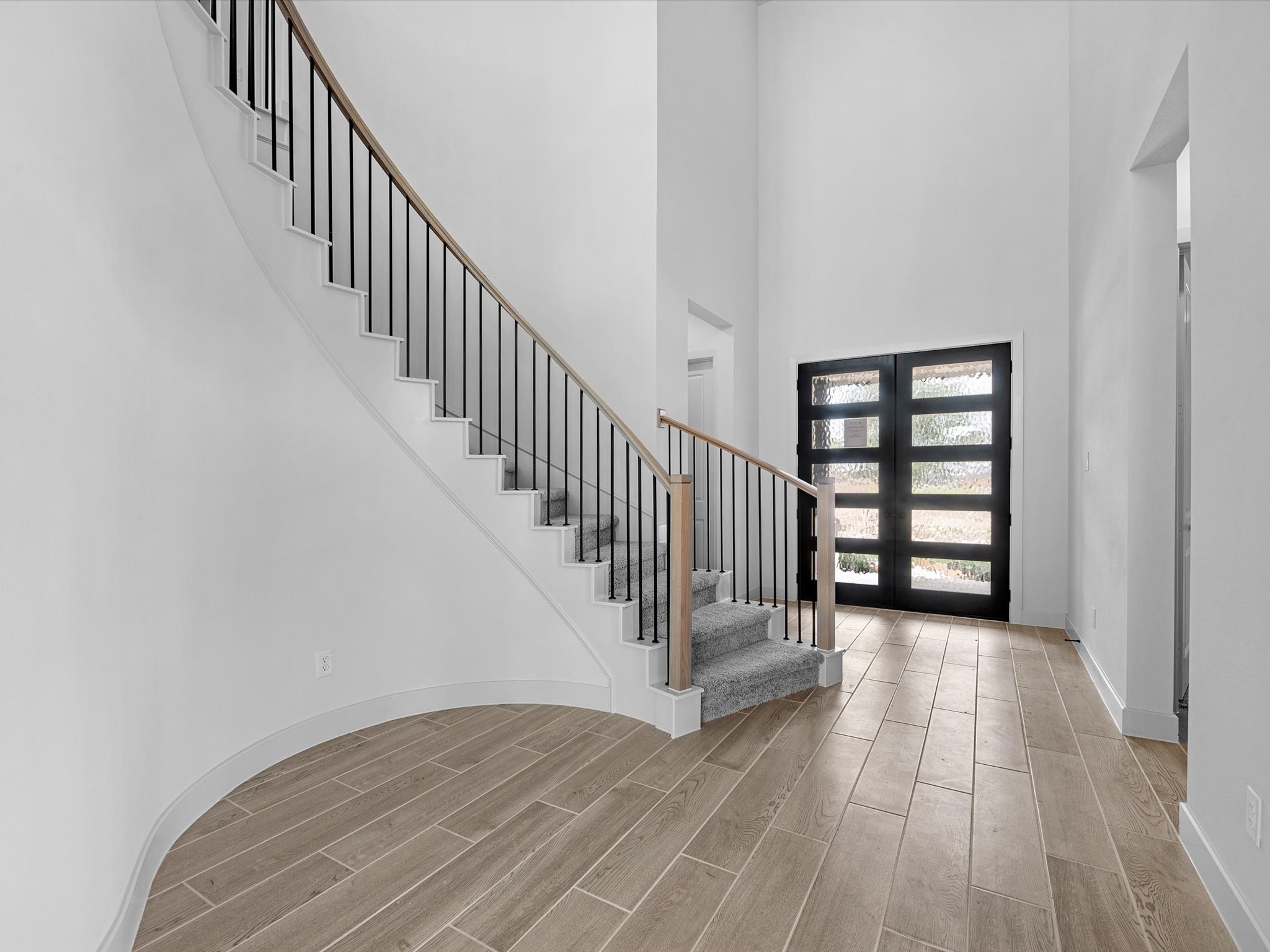 8915 Acropolis Lane Manvel, TX 77578 - Photo 18 of 32 a view of a hallway with wooden floor and entryway