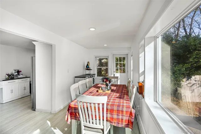 a dining room with furniture and window