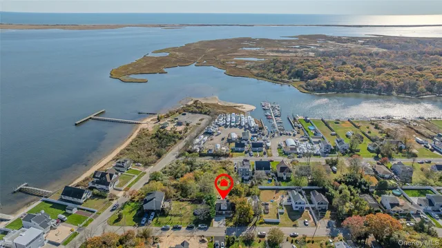 an aerial view of residential building and lake