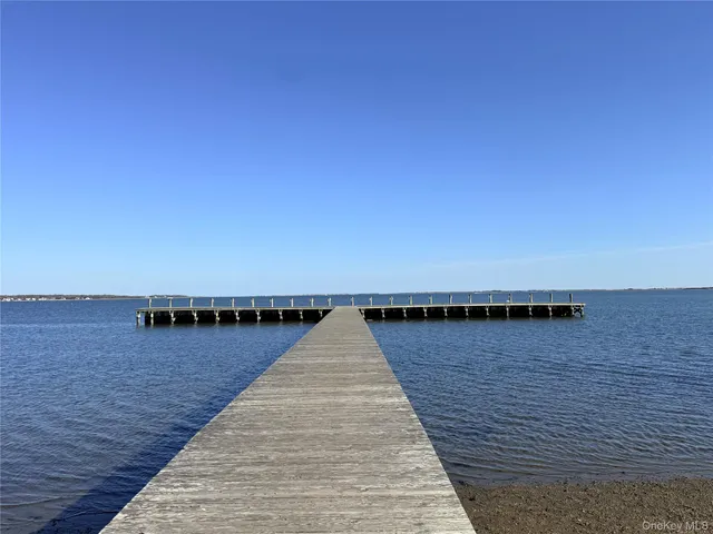 a picture of a bench in front of a wall