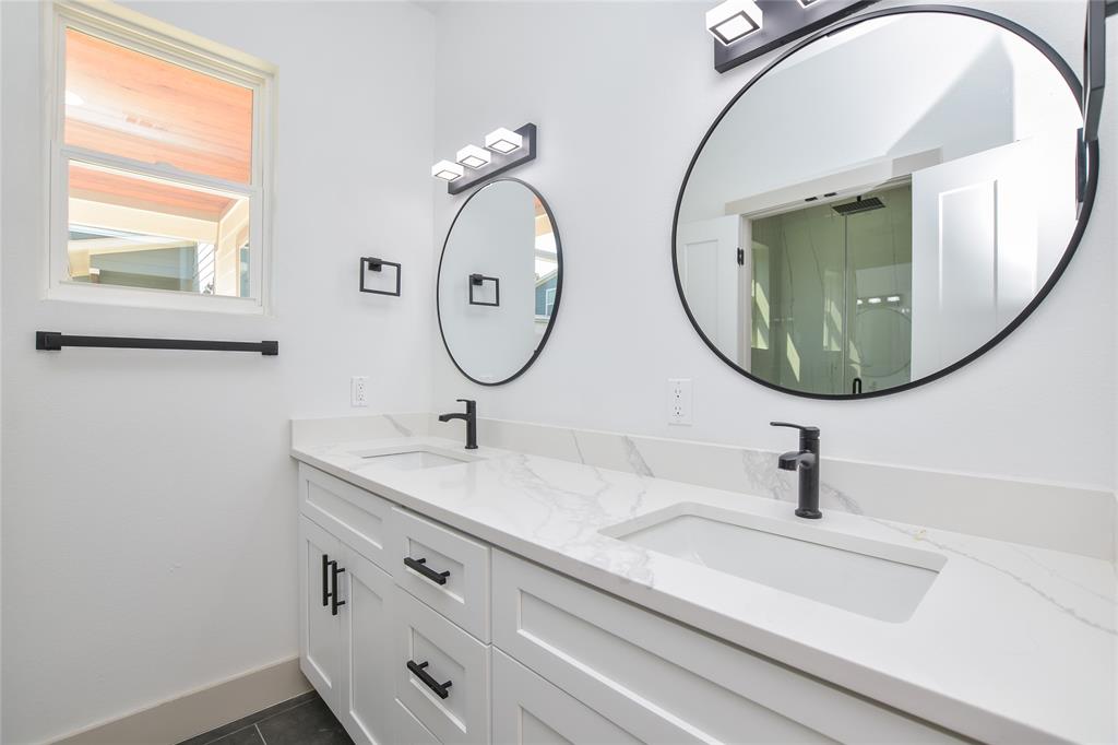 7103 Bennett Avenue, Unit 1 Austin, TX 78752 - Photo 12 of 25 a bathroom with a sink and a mirror