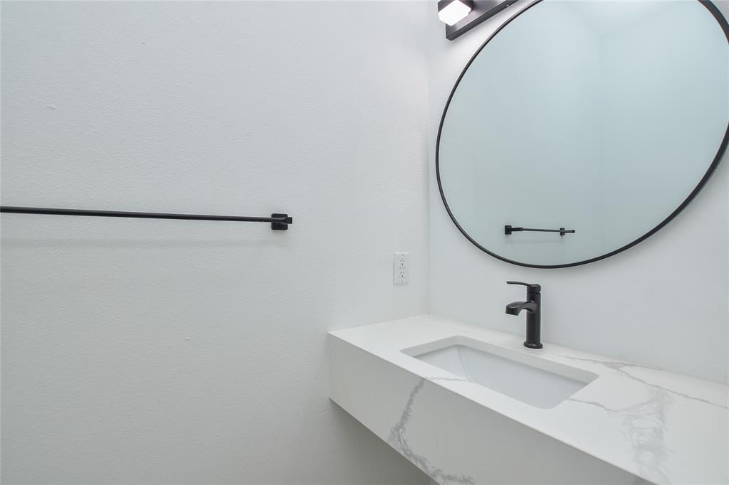 7103 Bennett Avenue, Unit 1 Austin, TX 78752 - Photo 14 of 25 a bathroom with a sink and a mirror