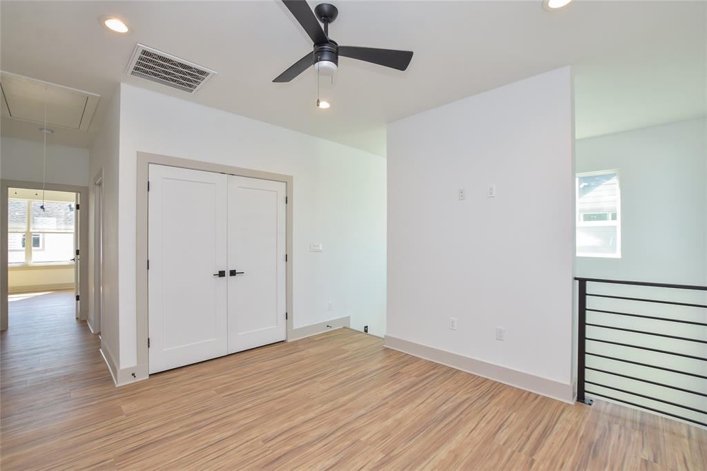 7103 Bennett Avenue, Unit 1 Austin, TX 78752 - Photo 15 of 25 a view of empty room with wooden floor