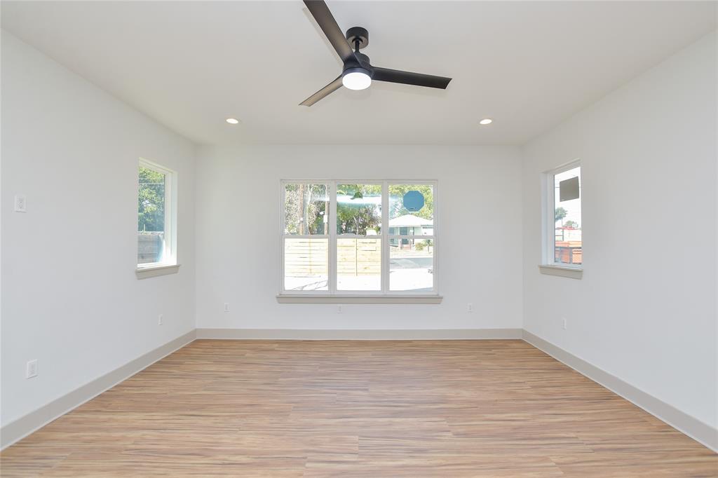 7103 Bennett Avenue, Unit 1 Austin, TX 78752 - Photo 4 of 25 wooden floor in an empty room with a window