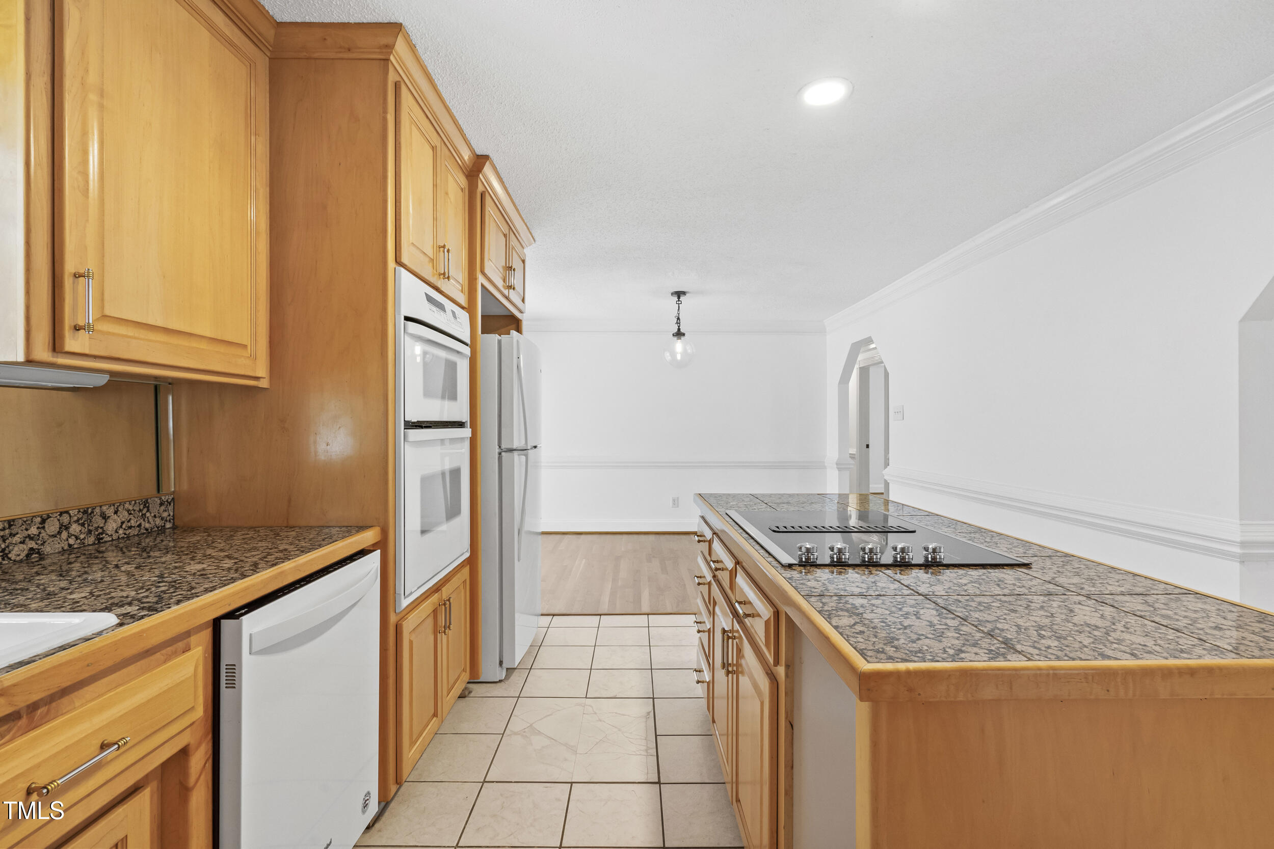 771 Brown Road Lillington, NC 27546 - Photo 12 of 37 a kitchen with granite countertop a sink and cabinets