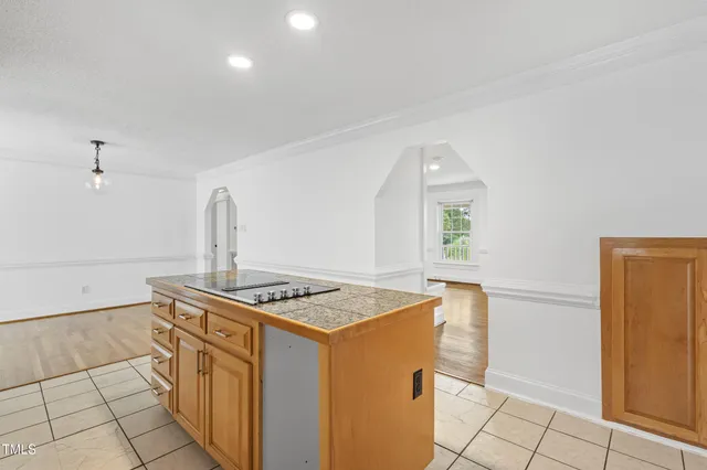a kitchen with stainless steel appliances granite countertop a sink and a stove