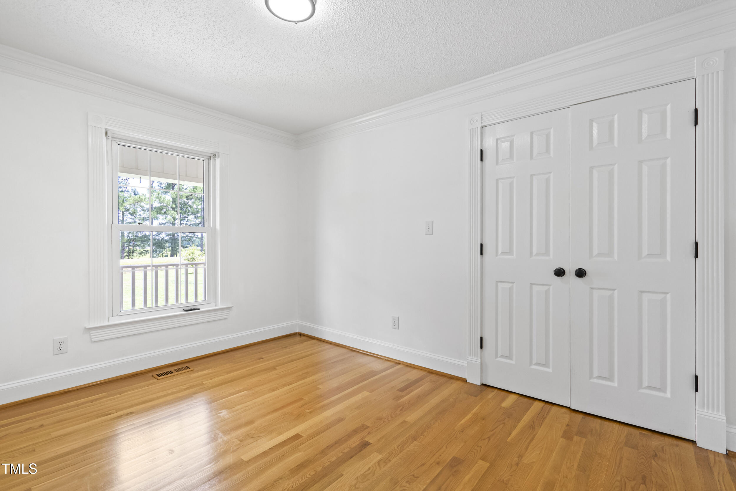771 Brown Road Lillington, NC 27546 - Photo 24 of 37 a view of empty room with wooden floor and fan