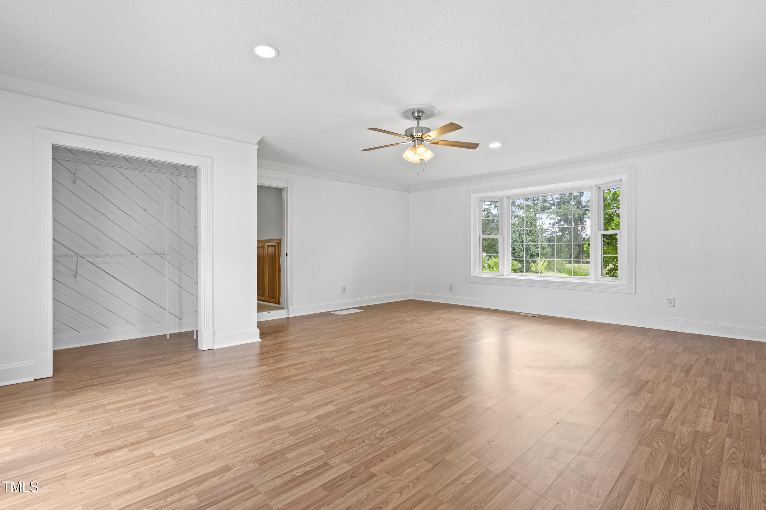 771 Brown Road Lillington, NC 27546 - Photo 29 of 37 an empty room with wooden floor and window