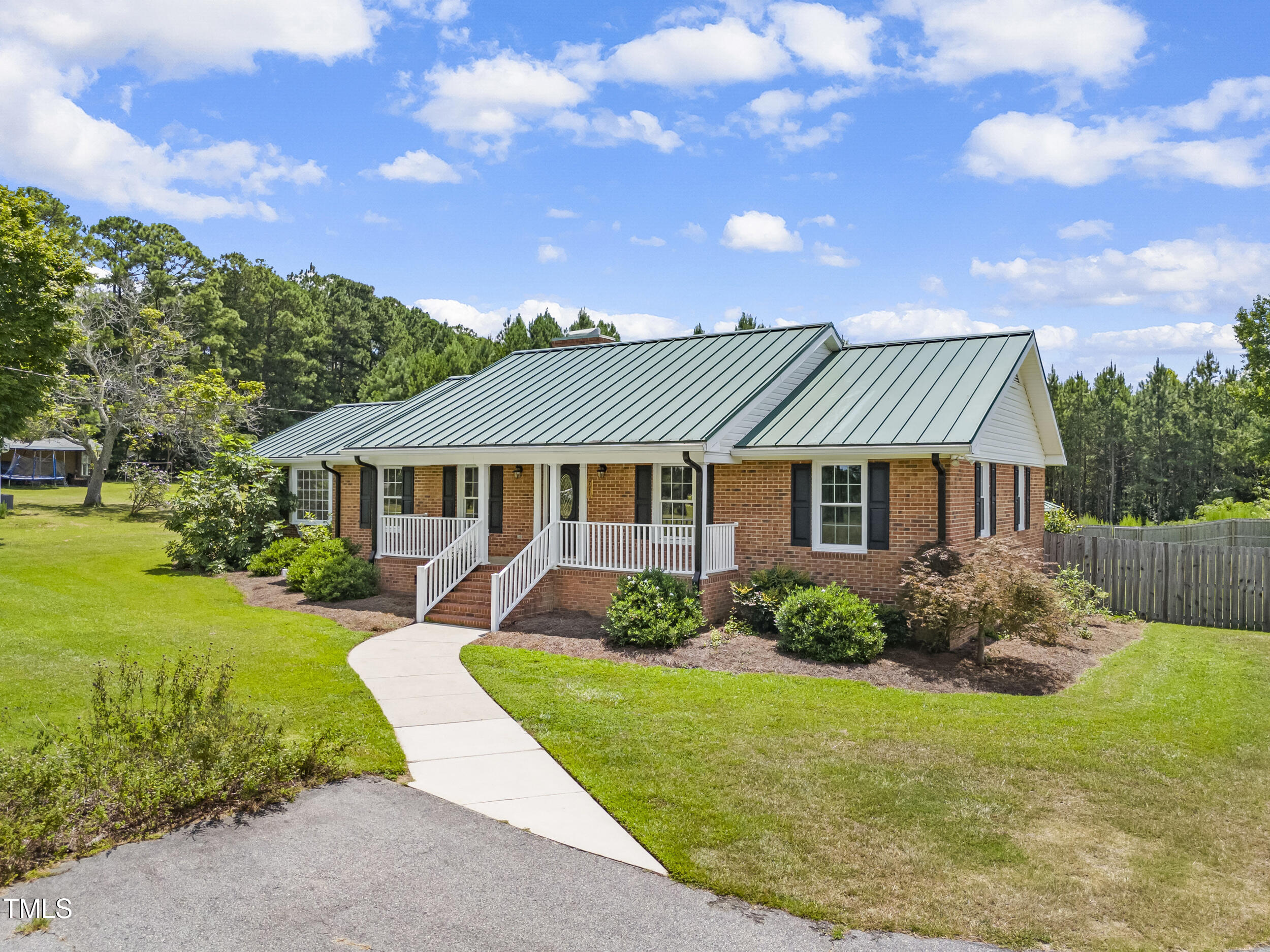 771 Brown Road Lillington, NC 27546 - Photo 2 of 37 a front view of a house with garden