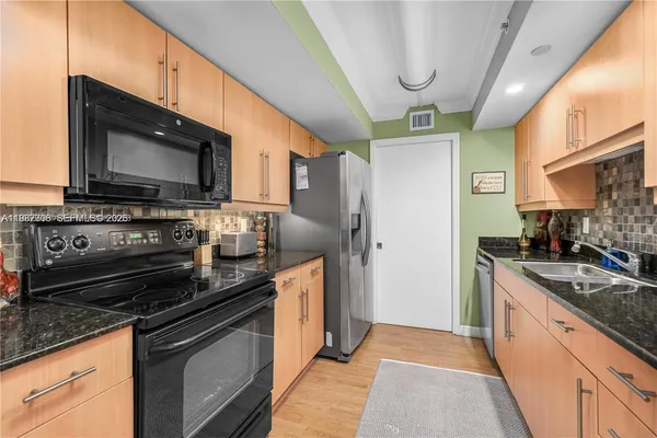 a view of a workspace with furniture