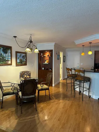 a utility room with a door a sink and a toilet