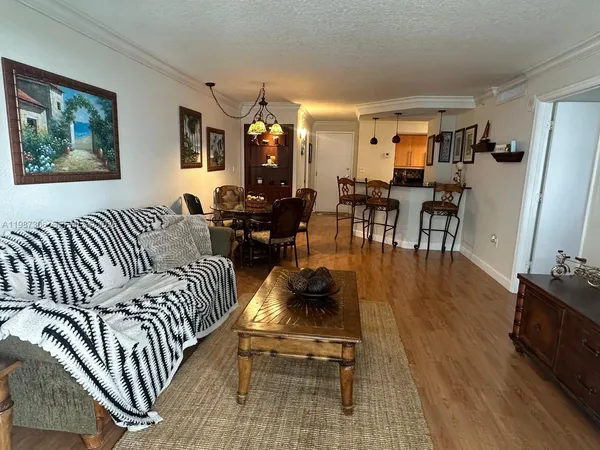 a bedroom with furniture and wooden floor