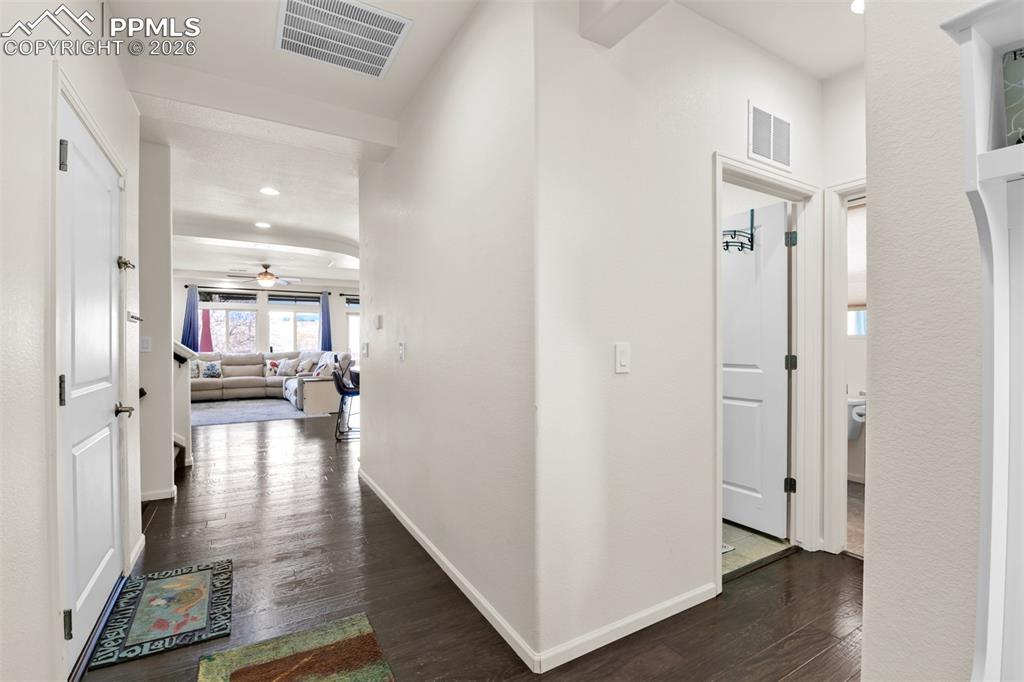 9290 Streamside Trail Fountain, CO 80817 - Photo 4 of 49 a view of a hallway view with wooden floor and living room